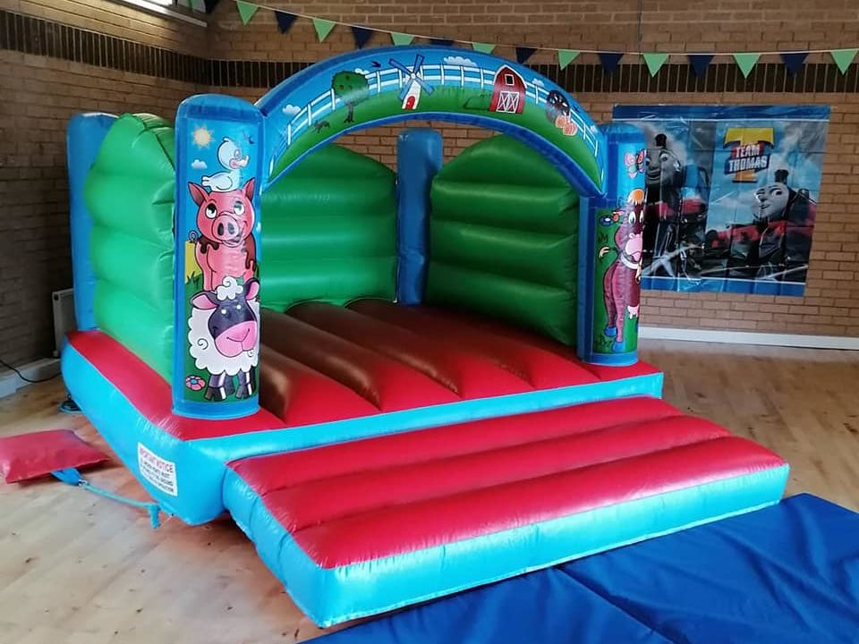 Toddler castle with farmyard design, perfect for a childrens party